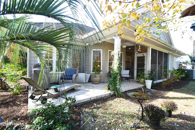 view of patio with a sunroom