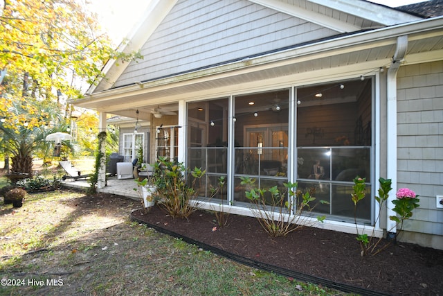 view of home's exterior featuring a patio area and a sunroom