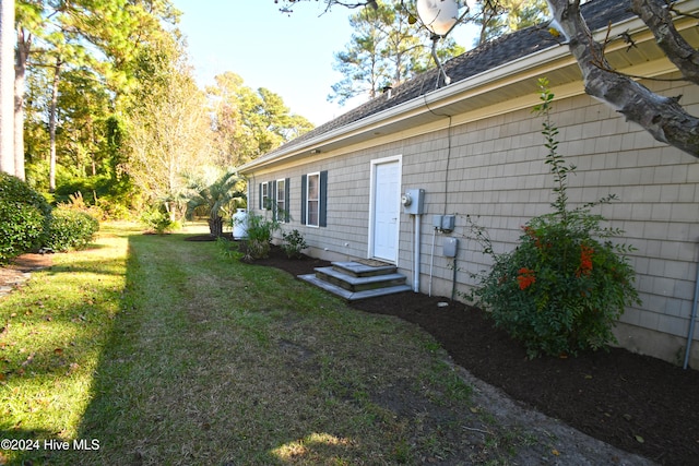 view of property exterior featuring a yard