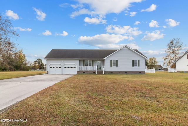 single story home with a porch, a garage, and a front lawn