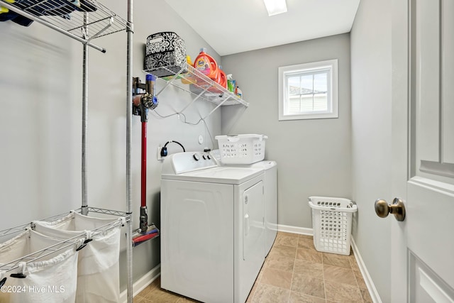 washroom featuring washer and clothes dryer