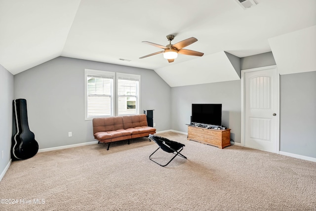 carpeted living room featuring ceiling fan and lofted ceiling