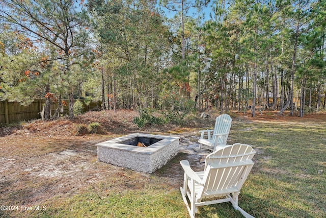 view of yard featuring an outdoor fire pit