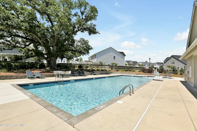 view of pool featuring a patio