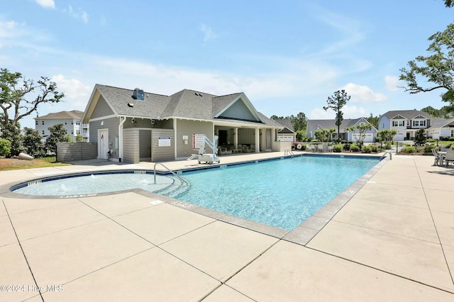 view of swimming pool with a patio