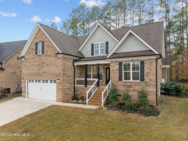 craftsman-style home with covered porch, a garage, and a front yard