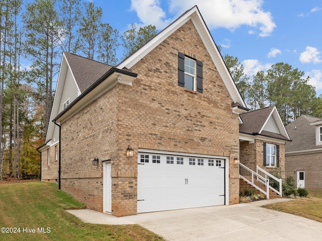 view of property exterior featuring a yard and a garage