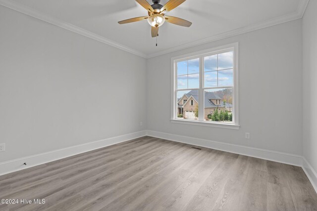 bathroom with hardwood / wood-style flooring, toilet, crown molding, and an enclosed shower