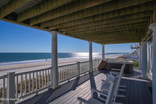 4316 Island Dr, North Topsail Beach, NC 28460 - wooden terrace with a hot tub and view of water and beach