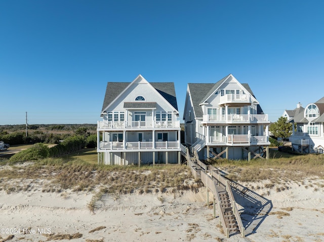 4316 Island Dr, North Topsail Beach, NC 28460 - rear view of property featuring a balcony and roof with shingles