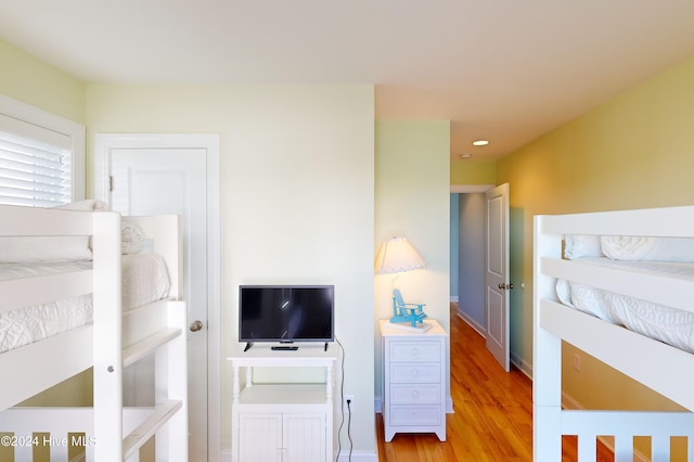 bedroom with light hardwood / wood-style floors