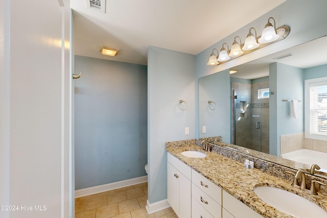 full bathroom with tile patterned flooring, vanity, toilet, and independent shower and bath