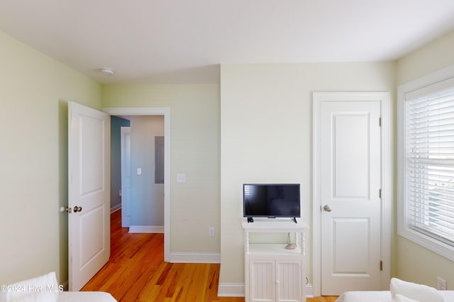 unfurnished bedroom featuring light wood-type flooring