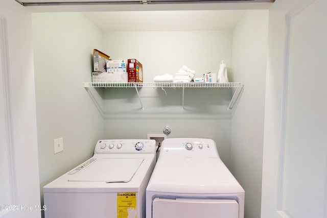 washroom with washer and dryer