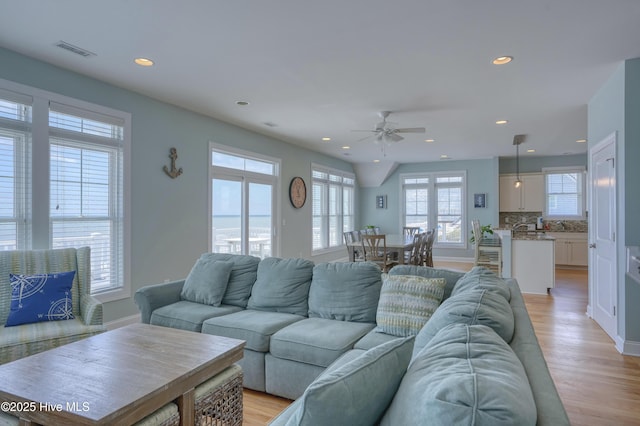 4316 Island Dr, North Topsail Beach, NC 28460 - living room with recessed lighting, ceiling fan, light wood finished floors, and baseboards