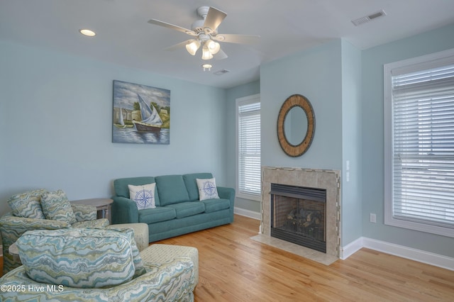 4316 Island Dr, North Topsail Beach, NC 28460 - living area featuring a tile fireplace, plenty of natural light, a ceiling fan, baseboards, and recessed lighting