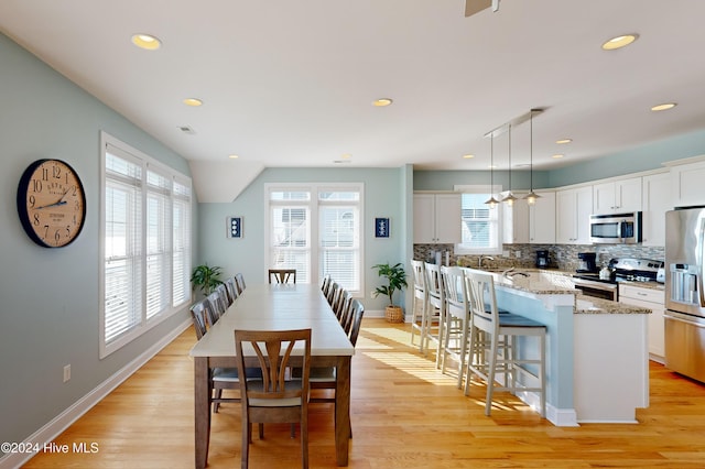 4316 Island Dr, North Topsail Beach, NC 28460 - dining room with baseboards, recessed lighting, and light wood-style flooring