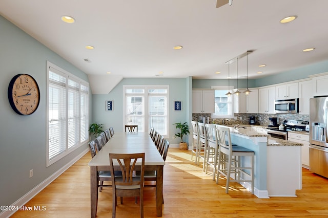 dining room with light wood-type flooring