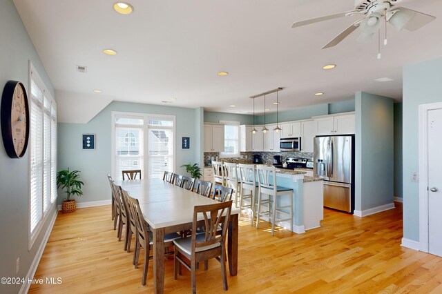 4316 Island Dr, North Topsail Beach, NC 28460 - dining room with light wood finished floors, baseboards, recessed lighting, and ceiling fan