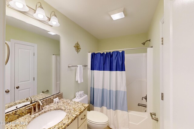 4316 Island Dr, North Topsail Beach, NC 28460 - bathroom with vanity, shower / bath combination with curtain, and toilet
