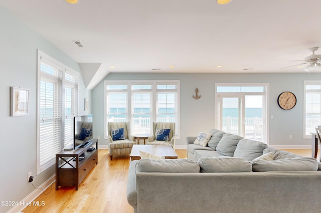 living room with ceiling fan and light wood-type flooring