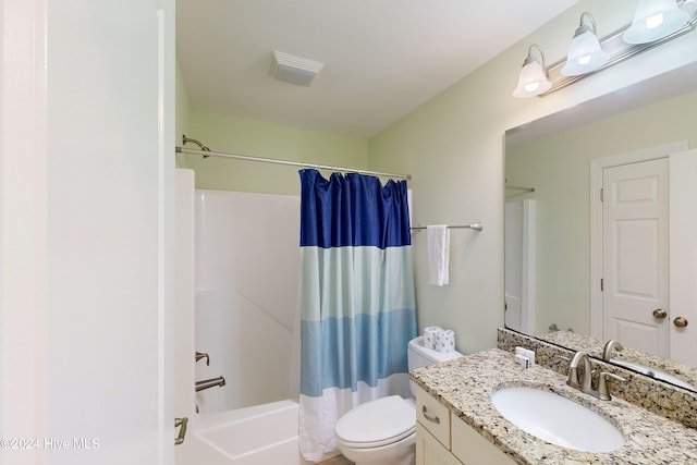 full bathroom with shower / tub combo, vanity, and toilet