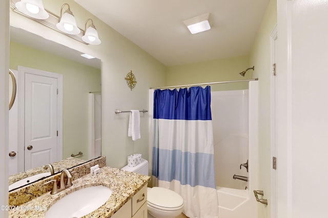 full bathroom featuring vanity, shower / bath combination with curtain, and toilet