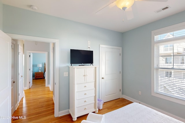 bedroom with ceiling fan and light wood-type flooring