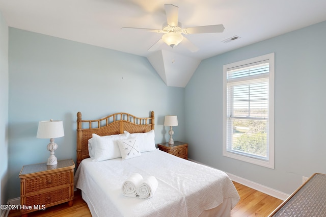 bedroom featuring wood-type flooring, ceiling fan, and lofted ceiling