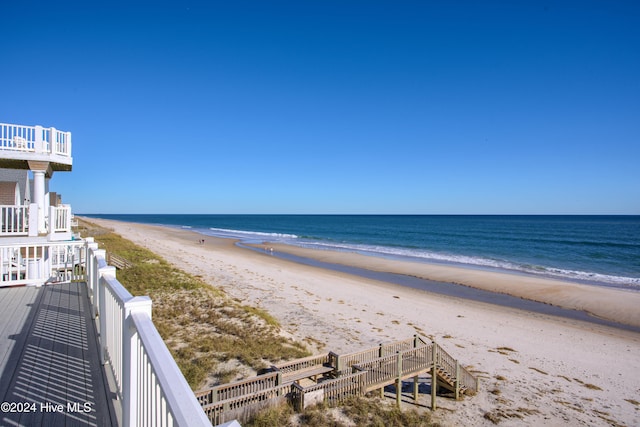 property view of water featuring a beach view