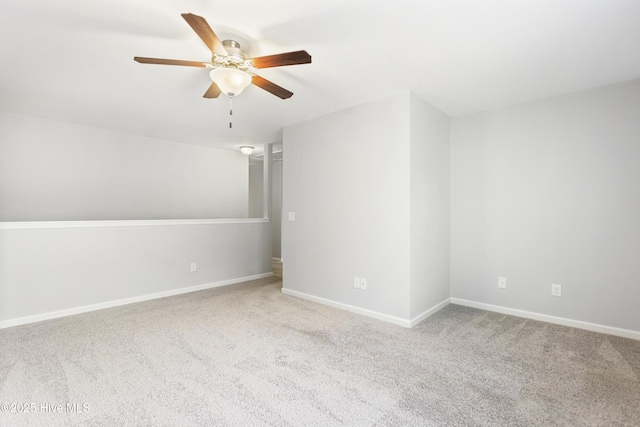 additional living space with ceiling fan and light colored carpet