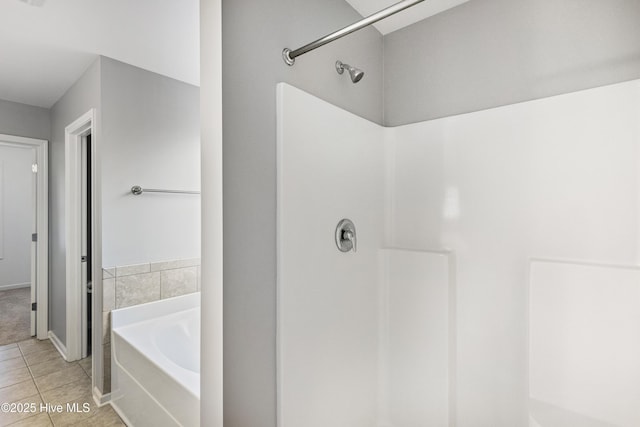 bathroom featuring plus walk in shower and tile patterned floors