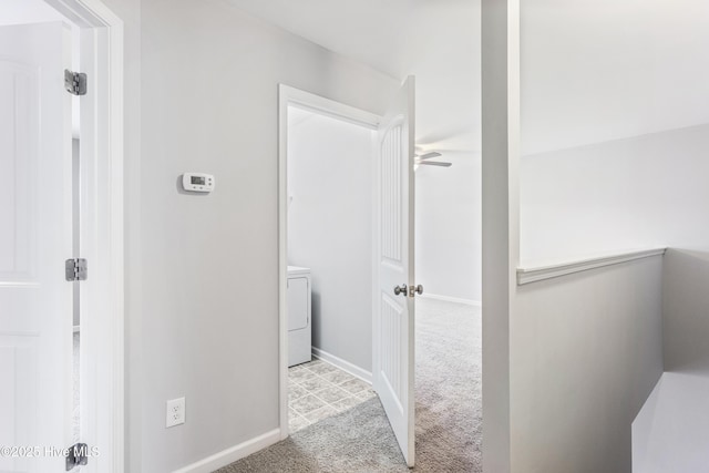 interior space with light colored carpet and washer / clothes dryer