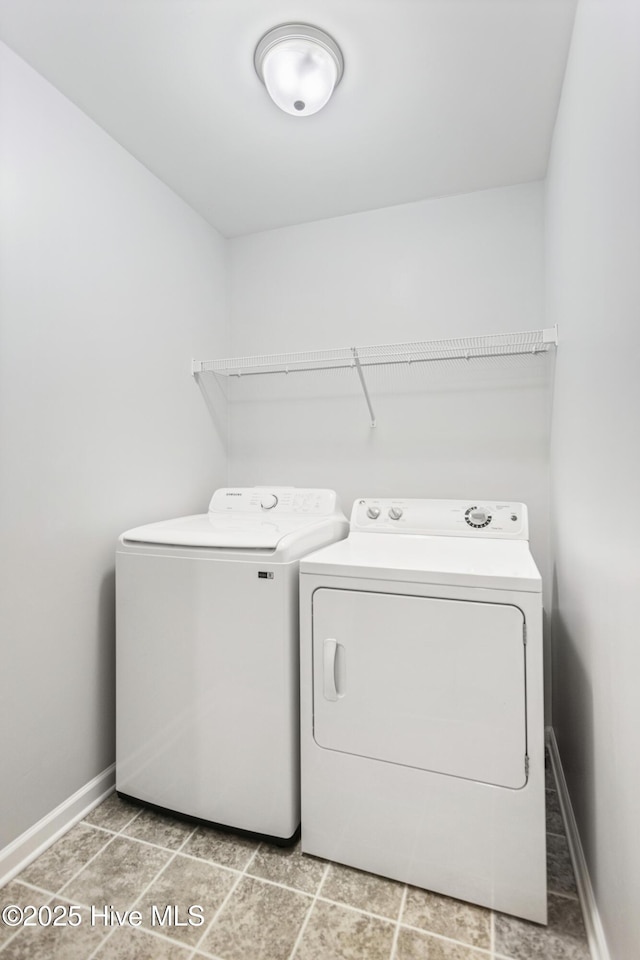 laundry room with washing machine and clothes dryer