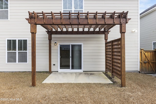 back of house featuring a patio, a lawn, and a pergola