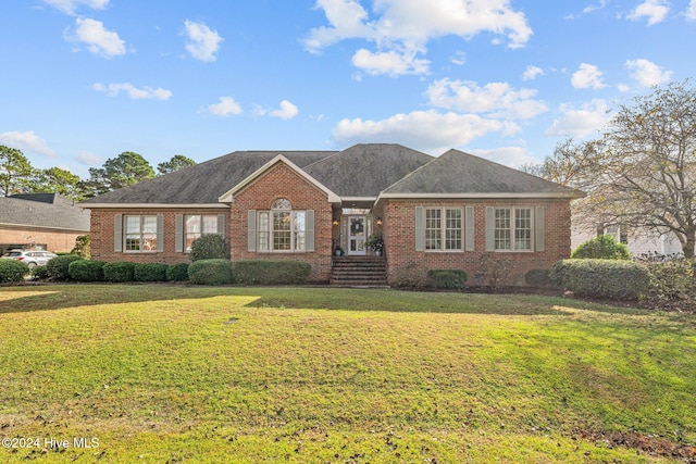 ranch-style home with a front yard