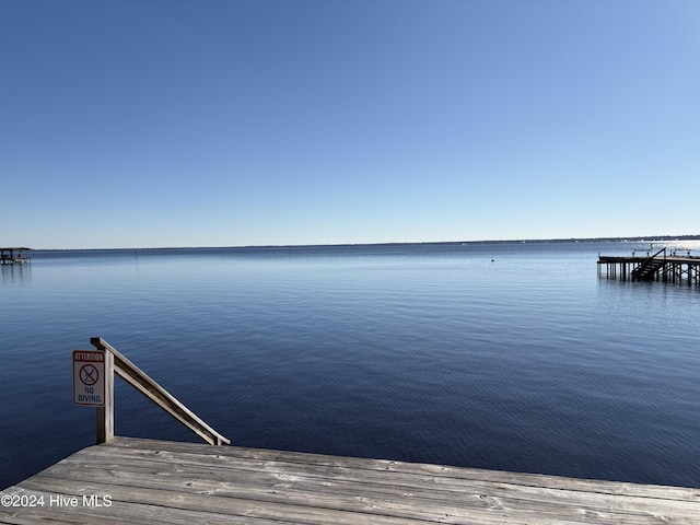 dock area featuring a water view