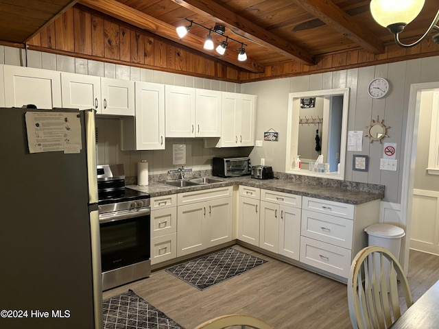 kitchen featuring sink, white cabinetry, appliances with stainless steel finishes, beam ceiling, and wood ceiling