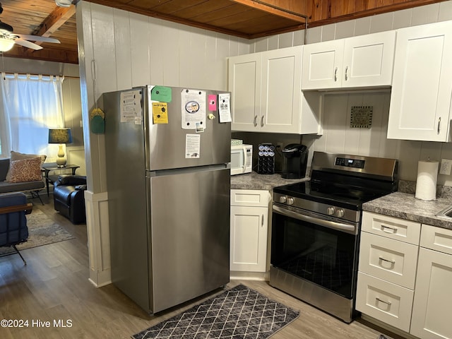 kitchen with white cabinetry, wooden ceiling, and appliances with stainless steel finishes