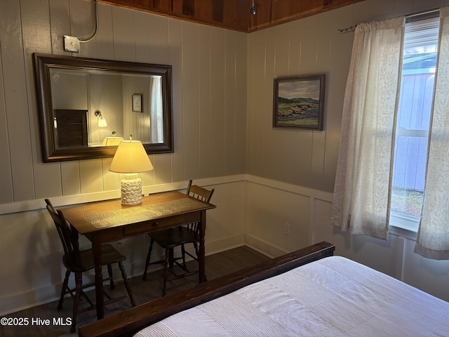 bedroom with dark wood-type flooring