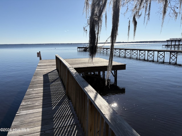 view of dock with a water view