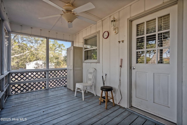 wooden deck featuring ceiling fan