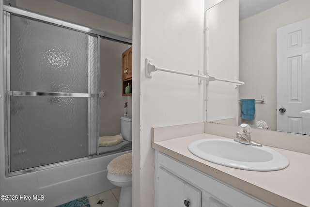 full bathroom with bath / shower combo with glass door, vanity, and toilet