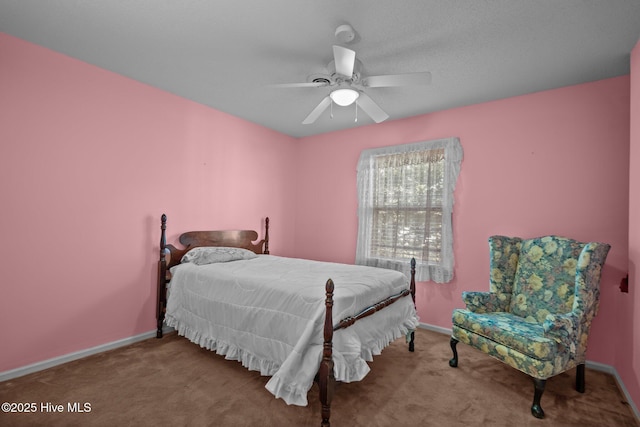 bedroom featuring baseboards and light colored carpet