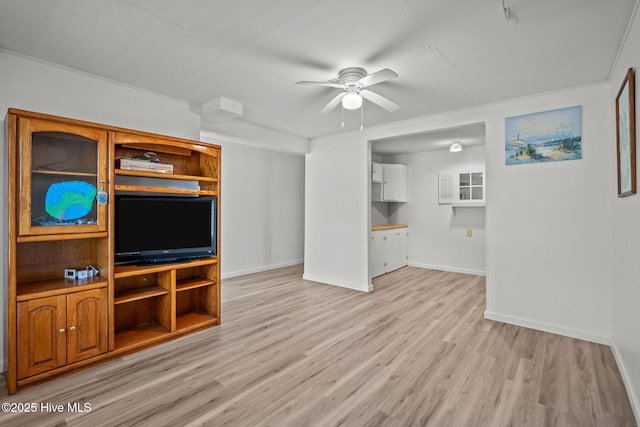 unfurnished living room with a ceiling fan, baseboards, and light wood finished floors