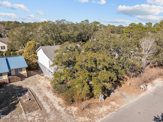 bird's eye view with a forest view