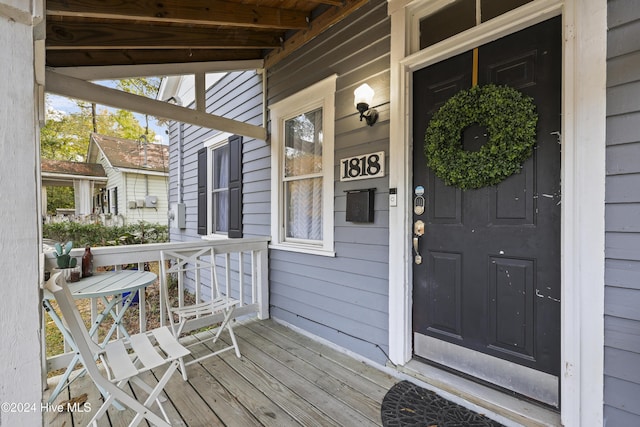 doorway to property featuring covered porch