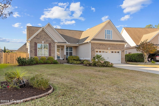 craftsman-style house featuring a garage and a front yard