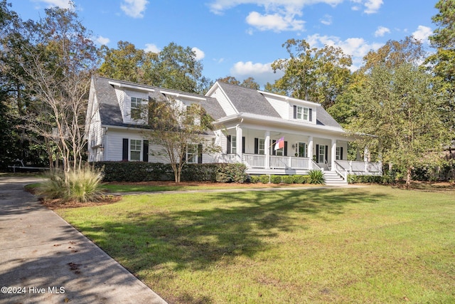 view of front of home with a porch and a front lawn