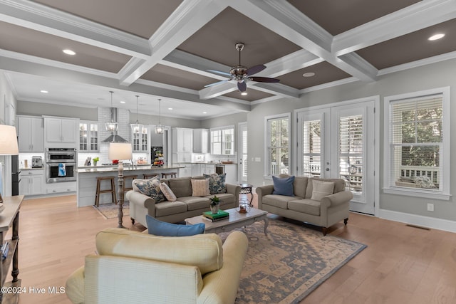 living room featuring beamed ceiling, light hardwood / wood-style floors, crown molding, and coffered ceiling